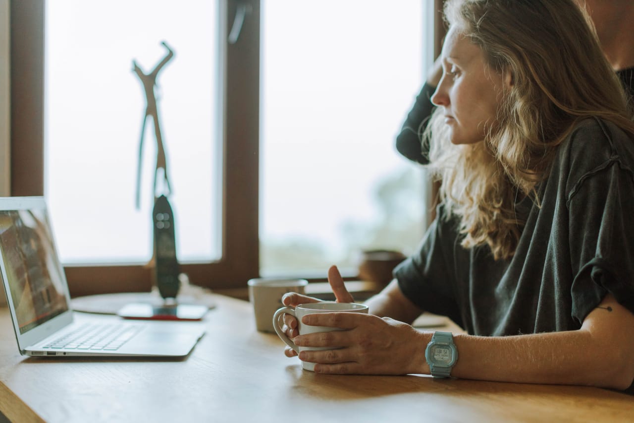 A remote worker at a desk in the cool early hours on Rote island
