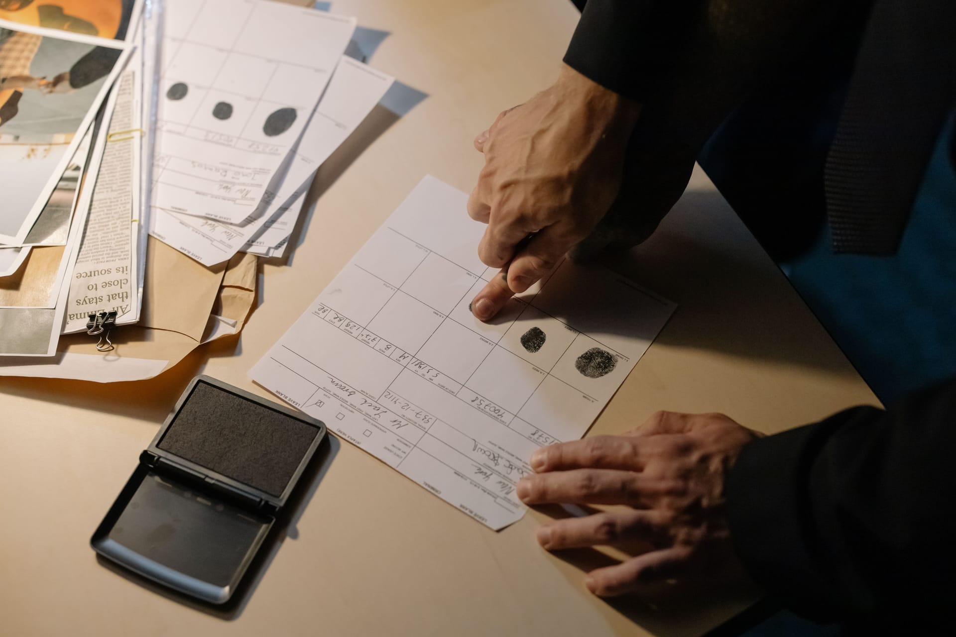 A foreigner handing documents to a clerk at a bank counter in Kupang