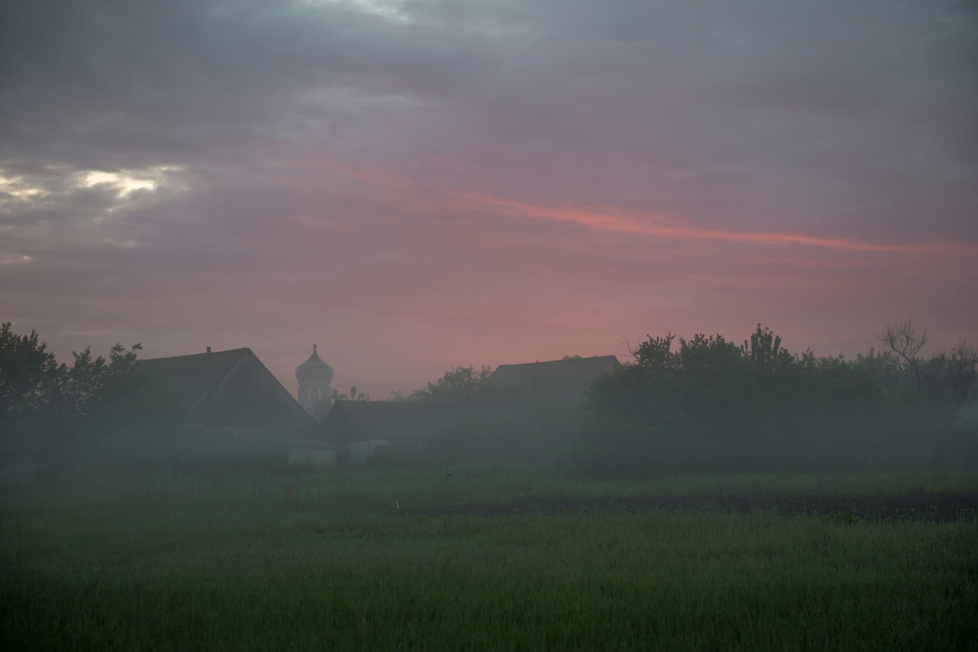 Rotenese villagers gathering outside a tin-roofed Protestant church at dawn on Rote island