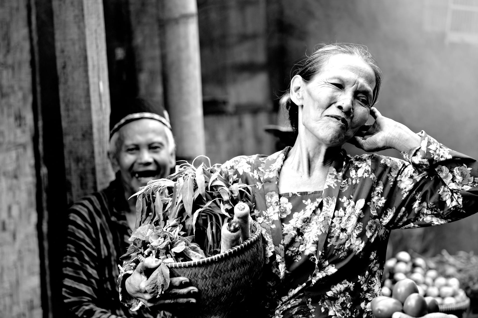 A foreign resident chatting with a local vendor at Ba'a market on Rote island in Indonesia