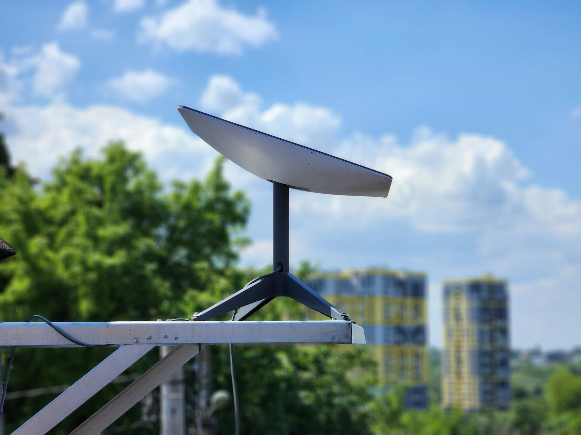 A Starlink dish bolted to a guesthouse roof on Rote island in the early morning light