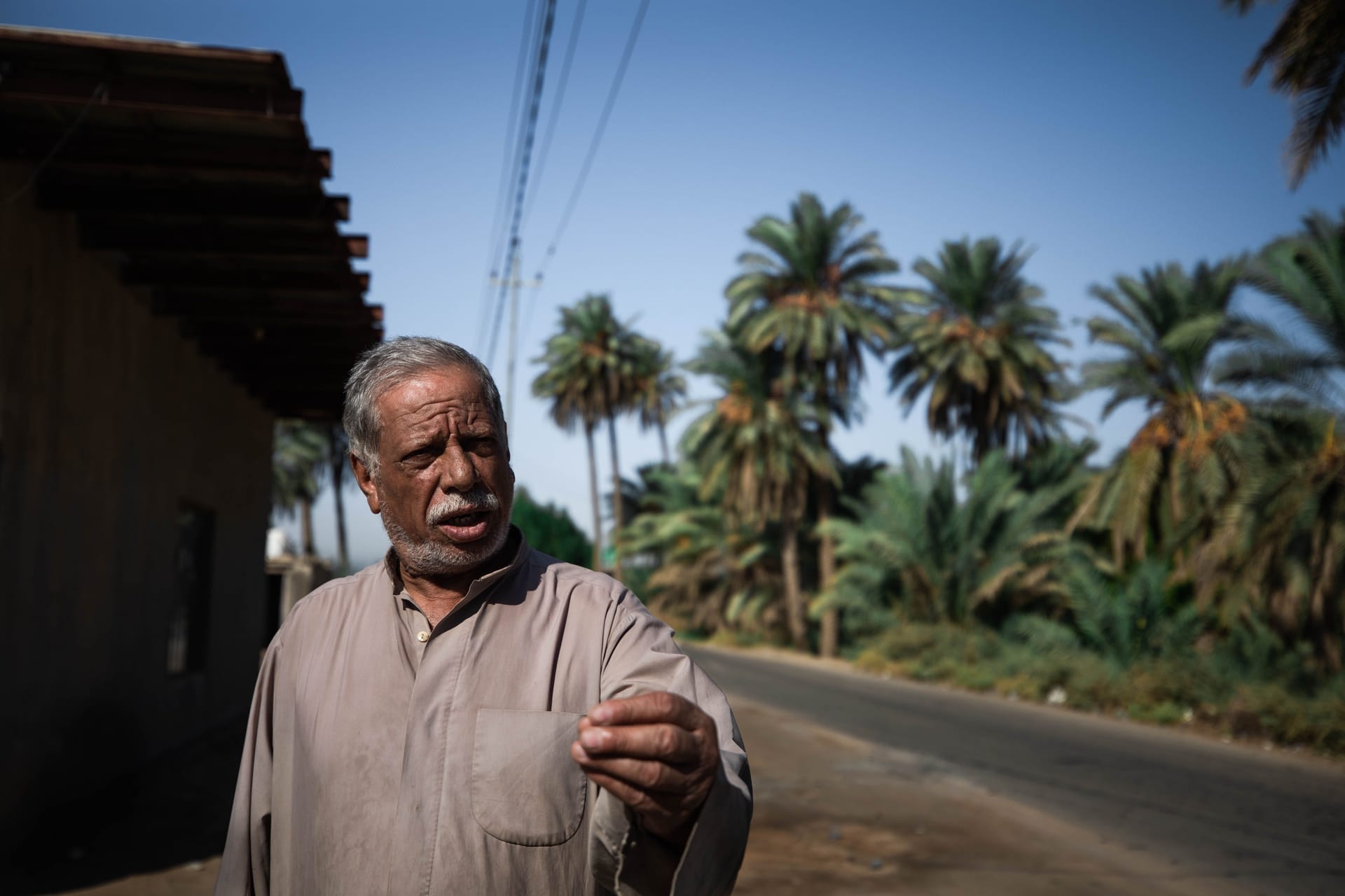 Rotenese family members gathered outside a simple village home on Rote island