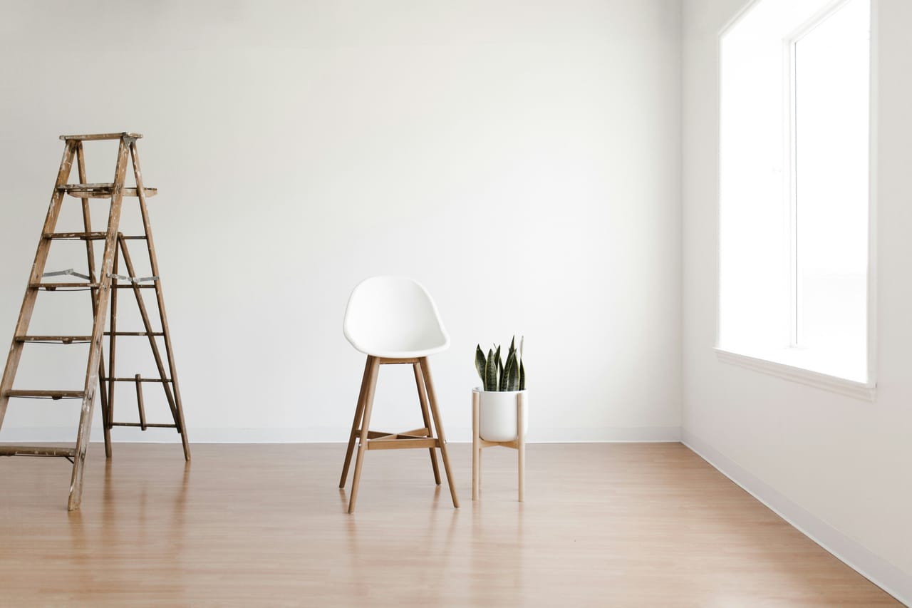 Damp interior of an island home with an open wardrobe and fan running to fight humidity