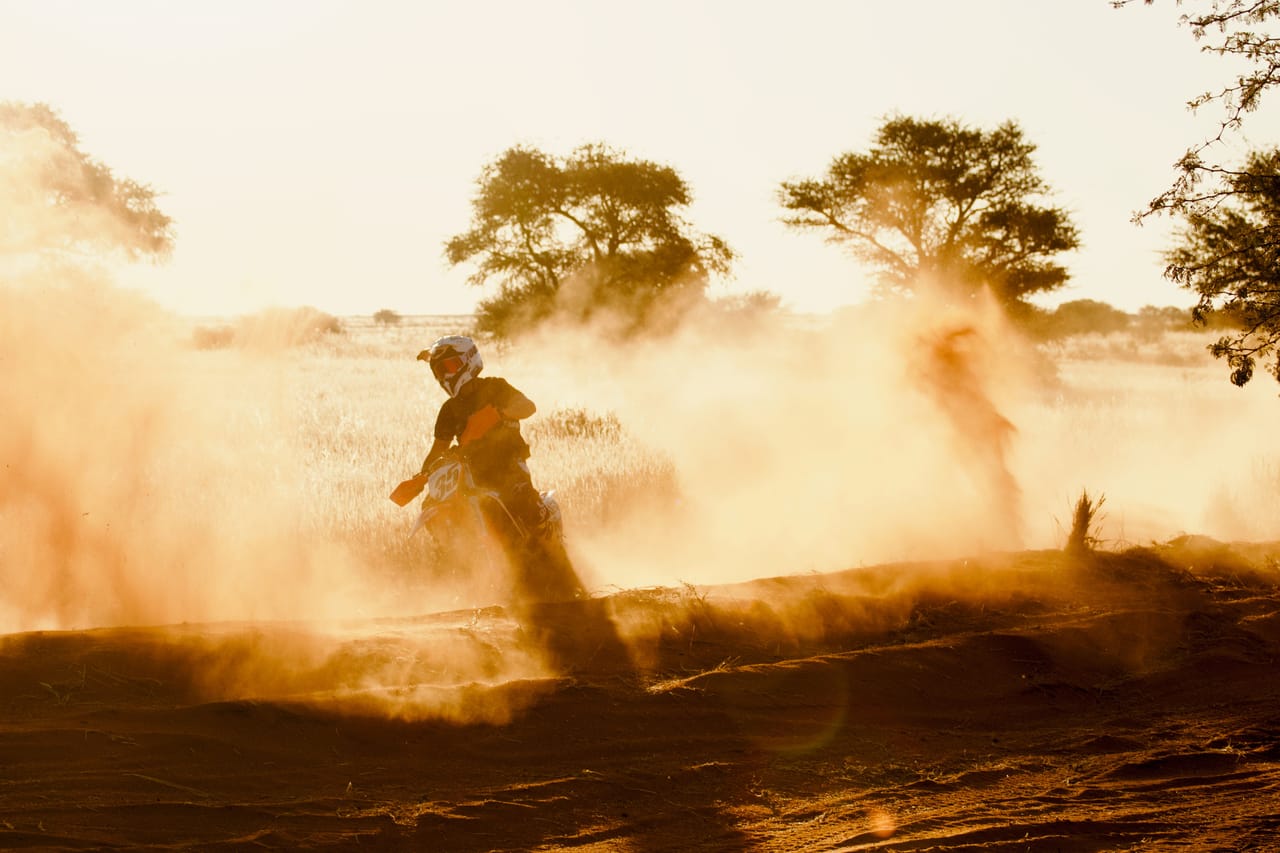 Motorbike on a dirt road crossing the terraced inland hills of Rote Island