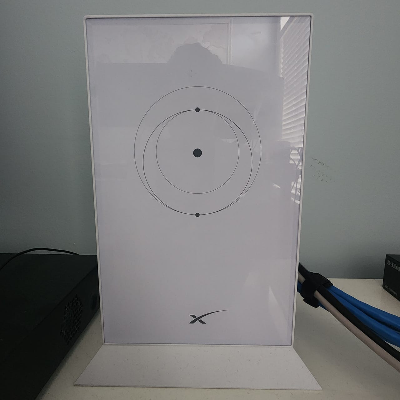 A Starlink router wired to a battery backup unit inside a home on Rote