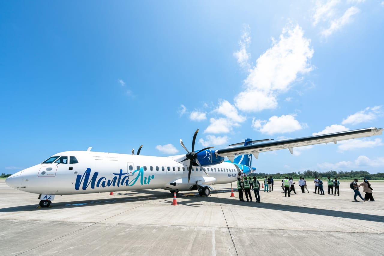 A small regional plane on the tarmac at a Sumba island airport