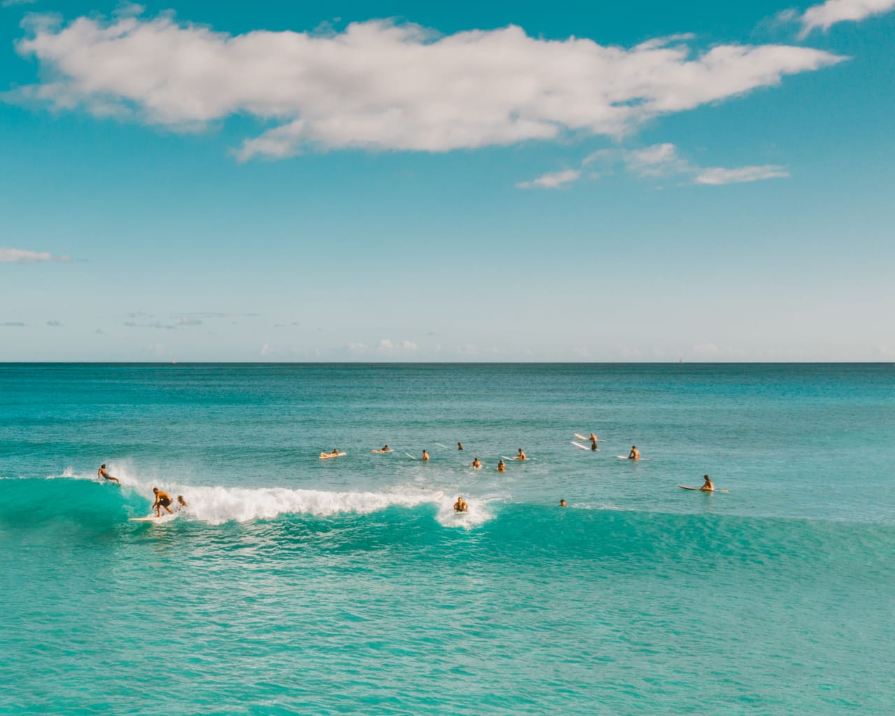 A local boat taking surfers out to the T-Land reef off Nemberala village