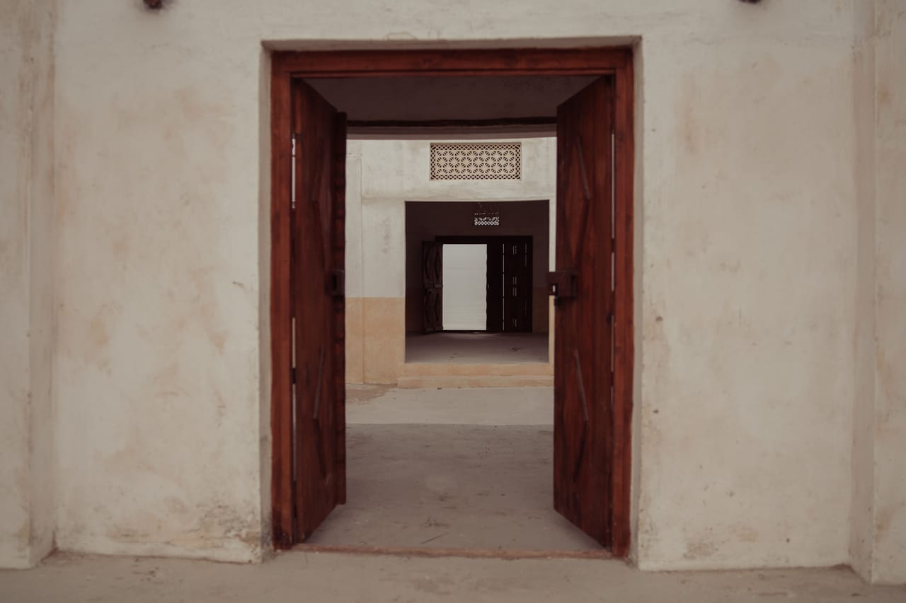 A person inspecting a simple beachfront house in person on Rote island before renting